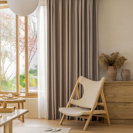 a living room with a chair and a table