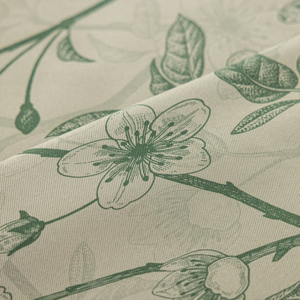 a close up of a flower on a sheet