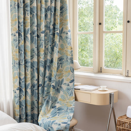 a bedroom with a bed, desk and window