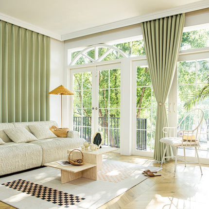 a living room filled with furniture and a large window