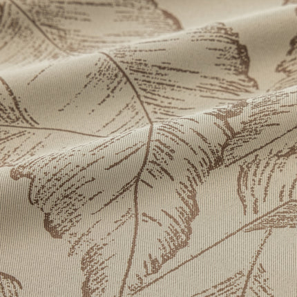 a close up of a fabric with leaves on it