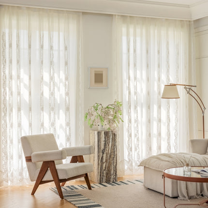 a living room filled with furniture and a large window