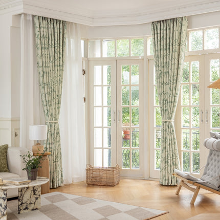 a living room filled with furniture and a large window