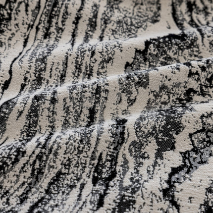 a close up of a black and white rug