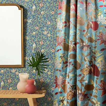 a mirror sitting on a table next to a window