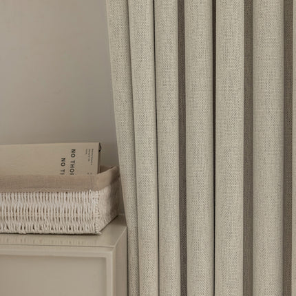a book sitting on top of a white table next to a window