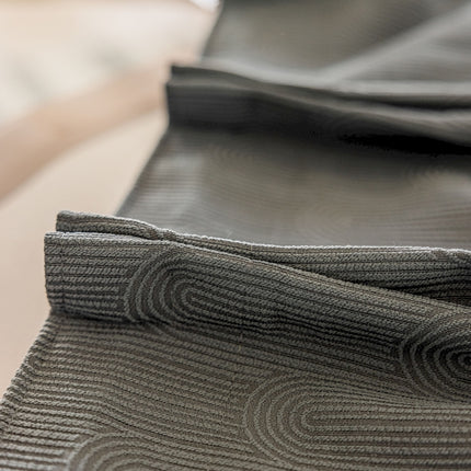 a close up of a tie on a table