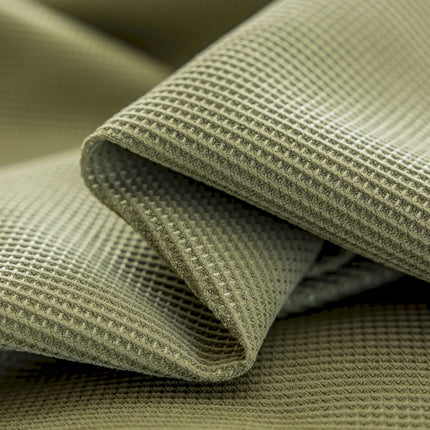 a close up view of a green fabric