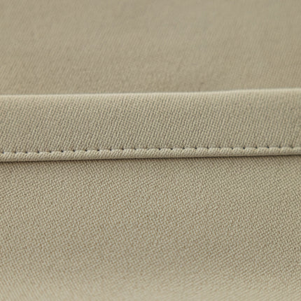 a close up of a beige fabric with stitching