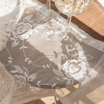 a glass of wine sitting on top of a table