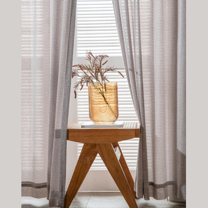 a wooden table with a vase on top of it