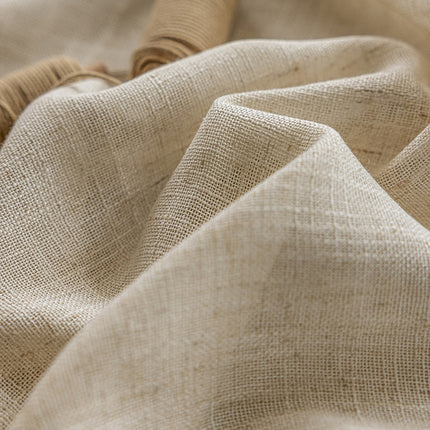 a close up view of a beige fabric