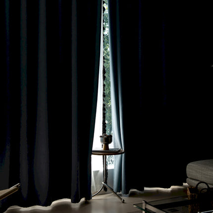 a living room with a couch and a window