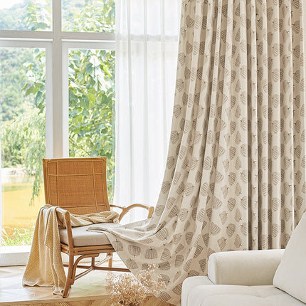 a living room with a chair and a window