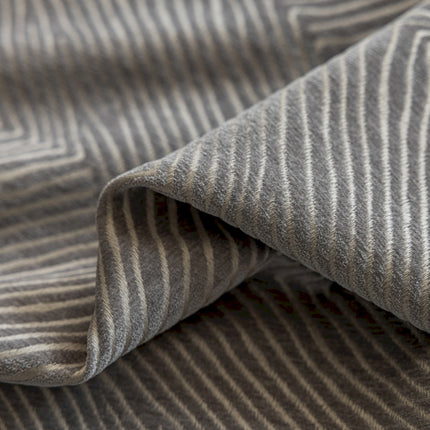 a close up of a gray and white striped fabric