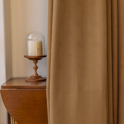 a wooden table with a candle on top of it