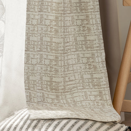 a close up of a blanket on a chair
