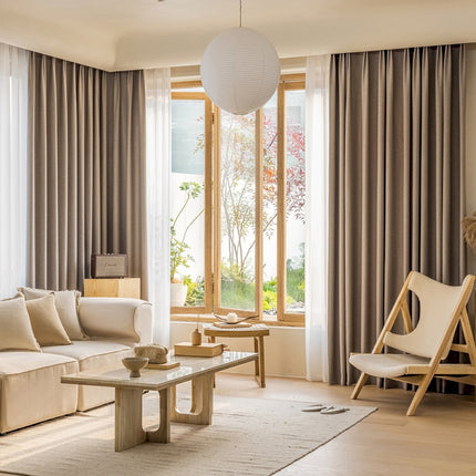 a living room filled with furniture and a large window