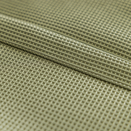 a close up view of a green fabric