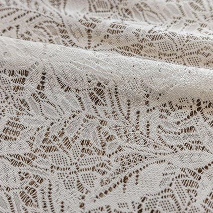 a close up of a white lace fabric