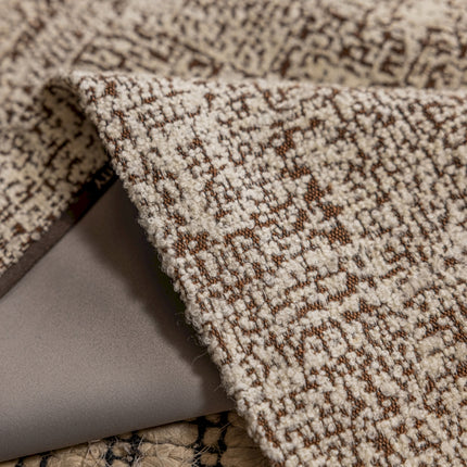 a laptop computer sitting on top of a rug