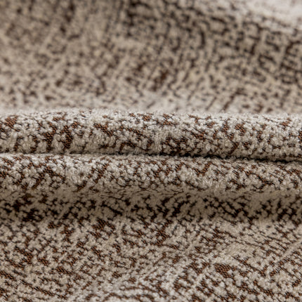 a close up of a brown and white blanket