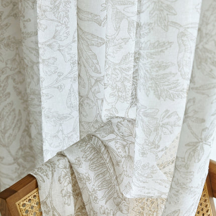 a close up of a window with a curtain
