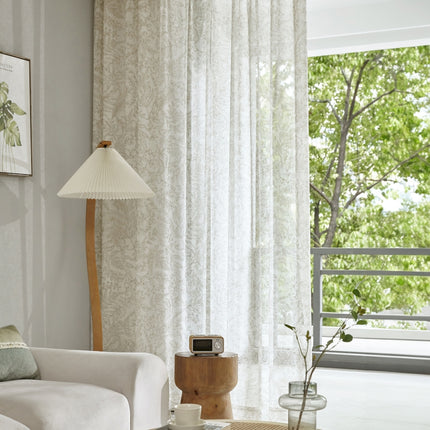 a living room filled with furniture and a lamp