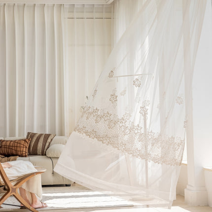 a woman sitting on a couch in a living room