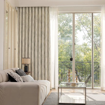 a living room filled with furniture and a large window