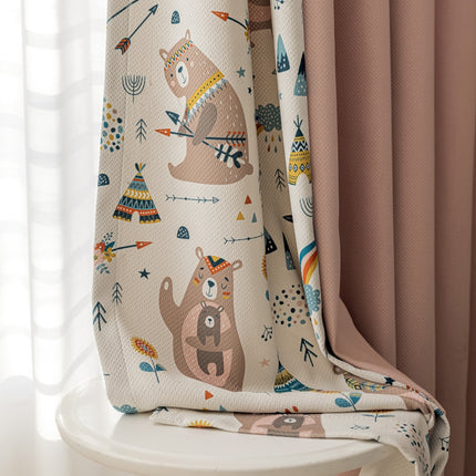 a blanket with a bear pattern on it
