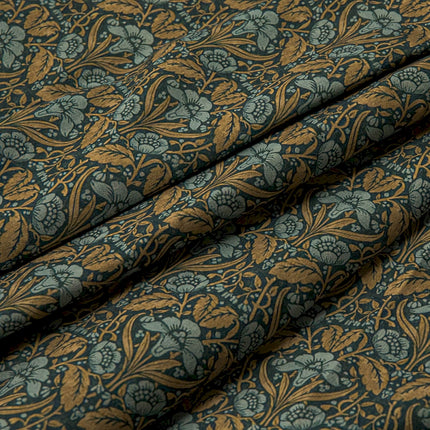 a close up of a blue and gold fabric