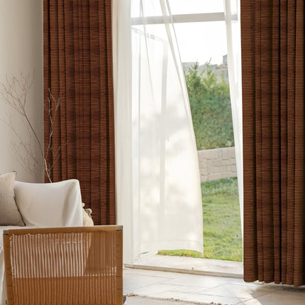 a living room with a couch and a window