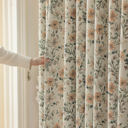 a person opening a curtain with their hand