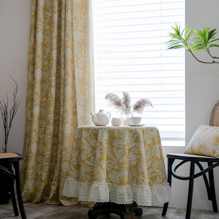 a table with two white vases on top of it