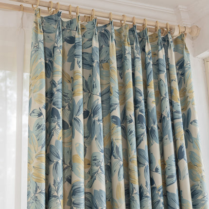 a curtain with a blue and yellow flower pattern