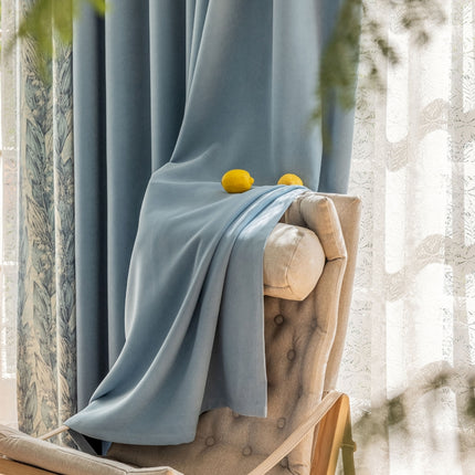 a chair with a blue blanket on top of it