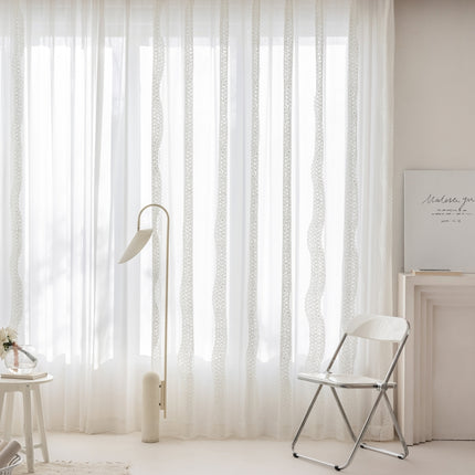 a white room with a chair and a table