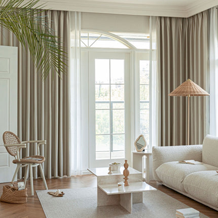 a living room filled with furniture and a large window