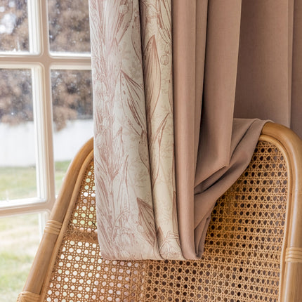 a wicker chair sitting next to a window