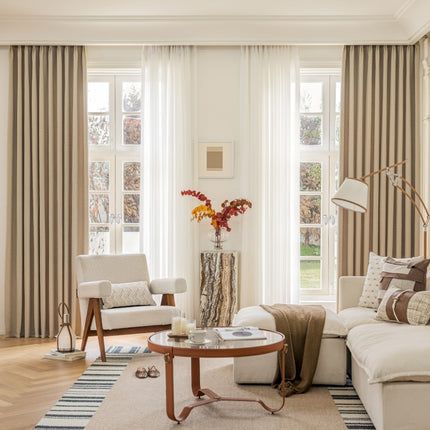 a living room filled with furniture and a large window