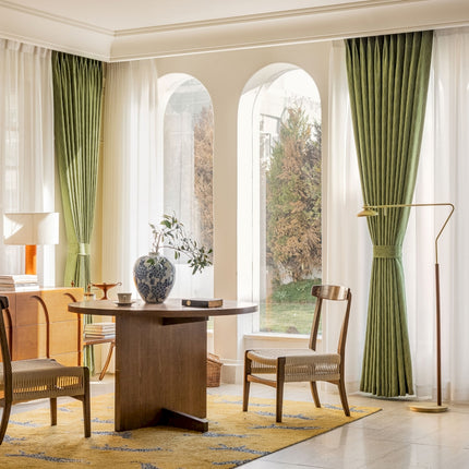 a living room with a table and chairs