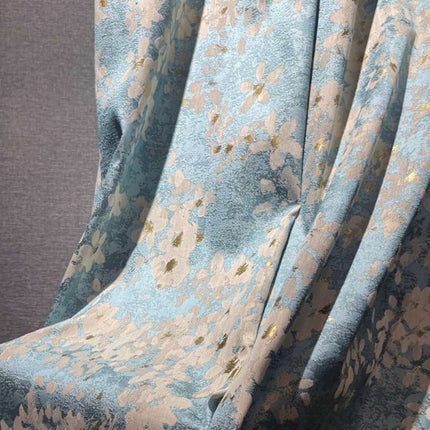 a close up of a chair with a flower pattern on it