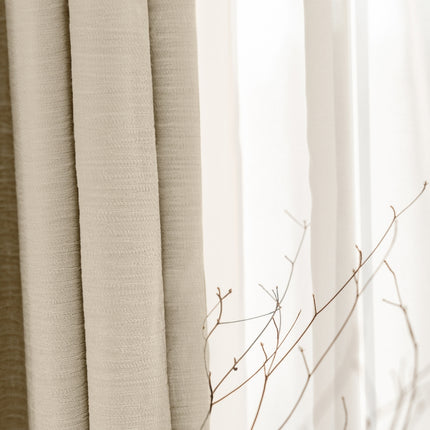 a close up of a window with a branch in front of it