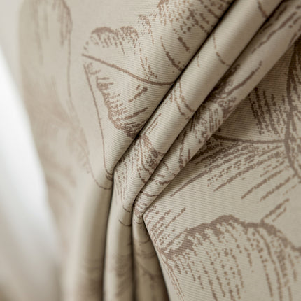 a close up of a curtain with a flower pattern