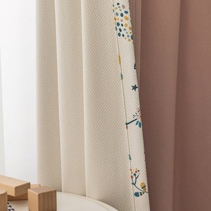 a bathroom with a toilet and a shower curtain