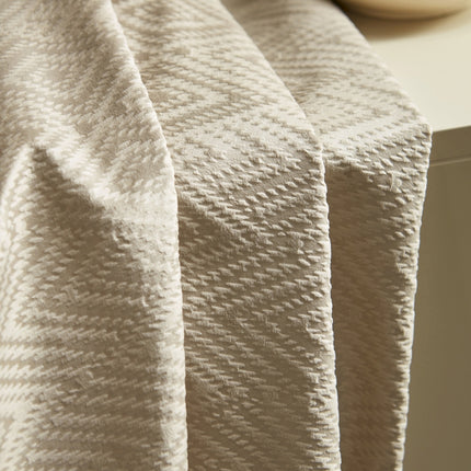 a close up of a blanket on a table