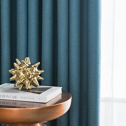 a table with a book and a gold star decoration on top of it