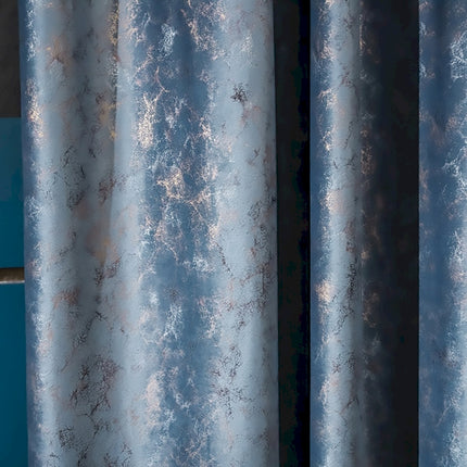 a close up of a curtain with a blue background