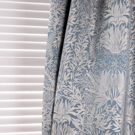 a curtain with a blue and white floral pattern